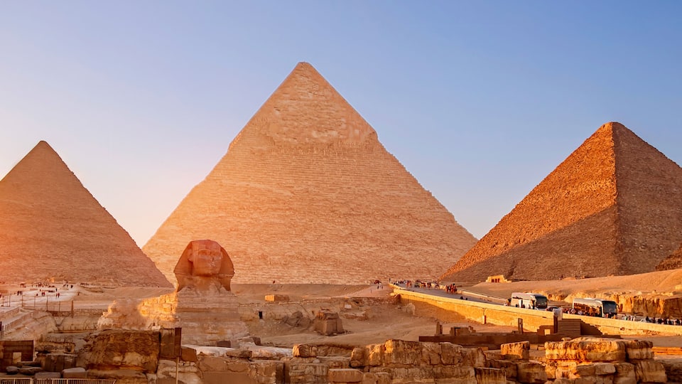 Banner view of famous wonder of world Sphinx and pyramids Giza, Egypt sunset