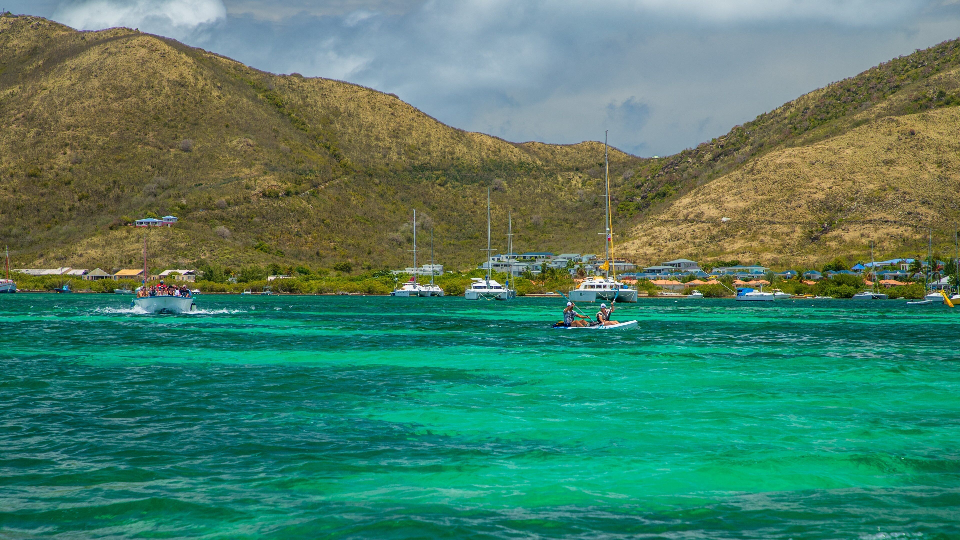 Pinel Island featuring kayaking or canoeing and general coastal views