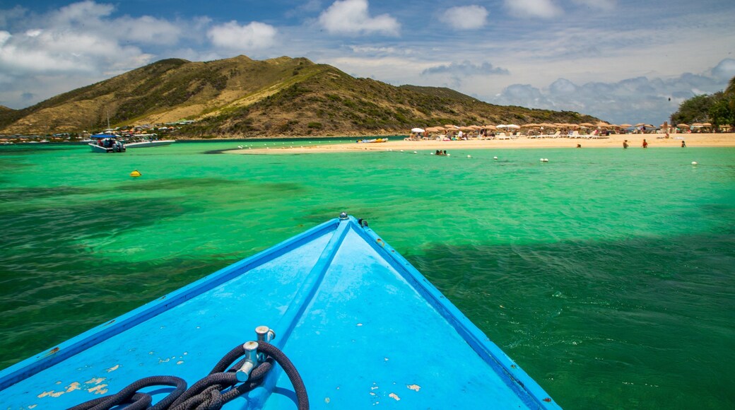 Pinel Island which includes boating and general coastal views