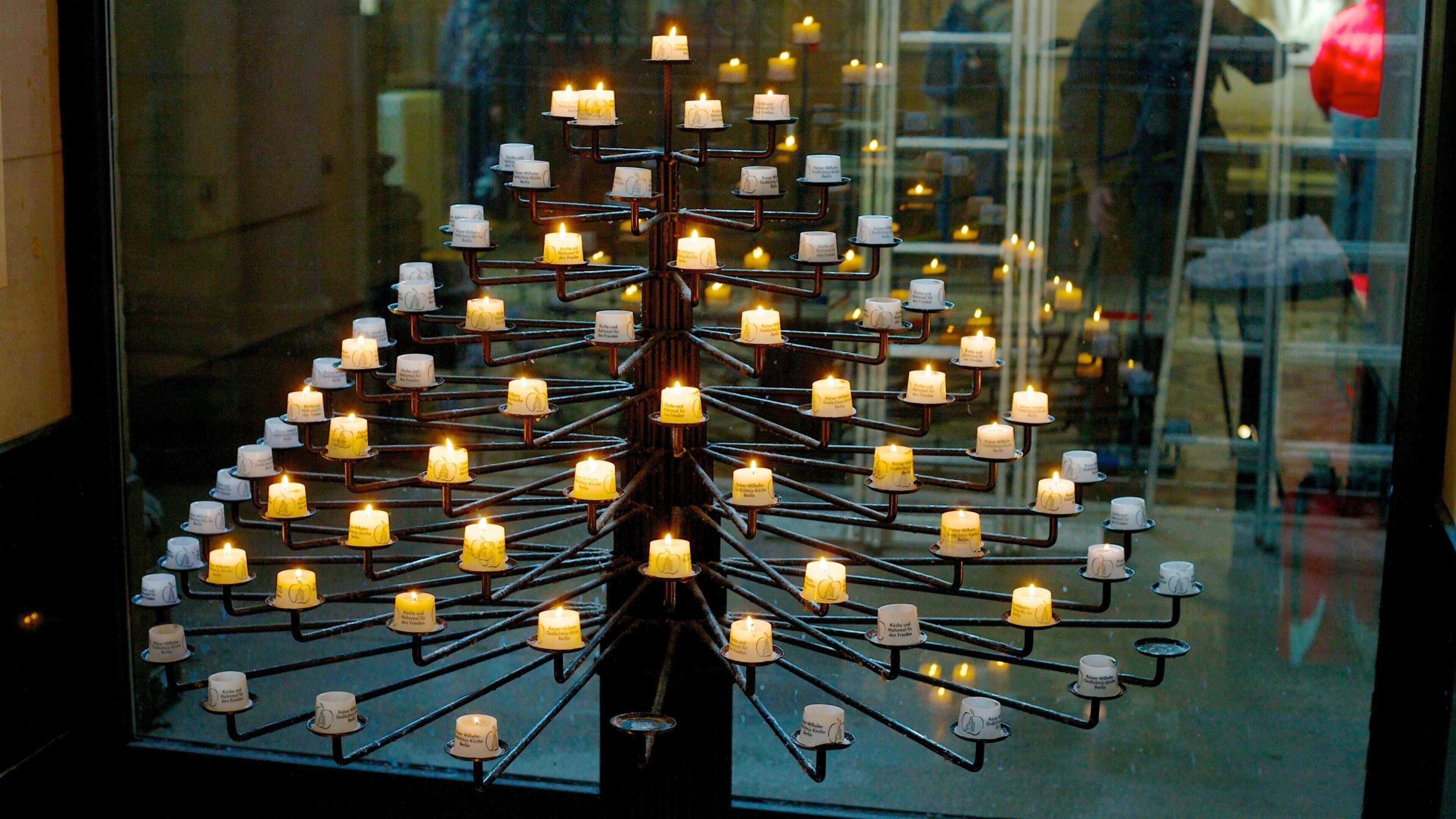 Kaiser Wilhelm Memorial Church which includes a church or cathedral, religious elements and interior views