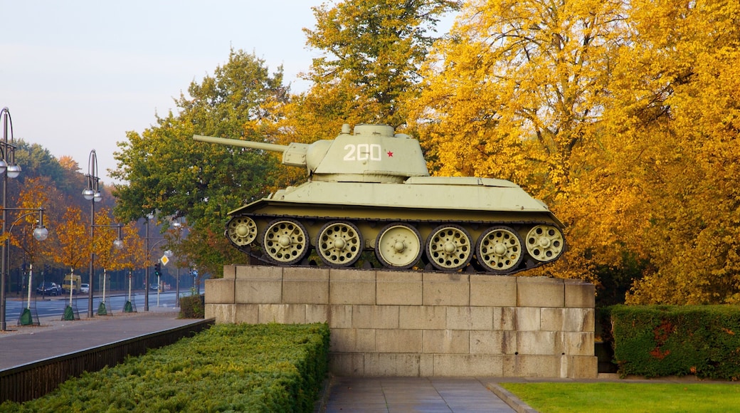 Tiergarten Soviet War Memorial featuring a monument, military items and forests