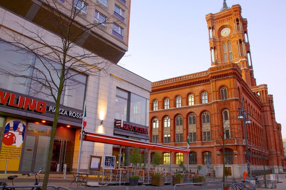 A bowling alley, a red brick building, and a clock tower.