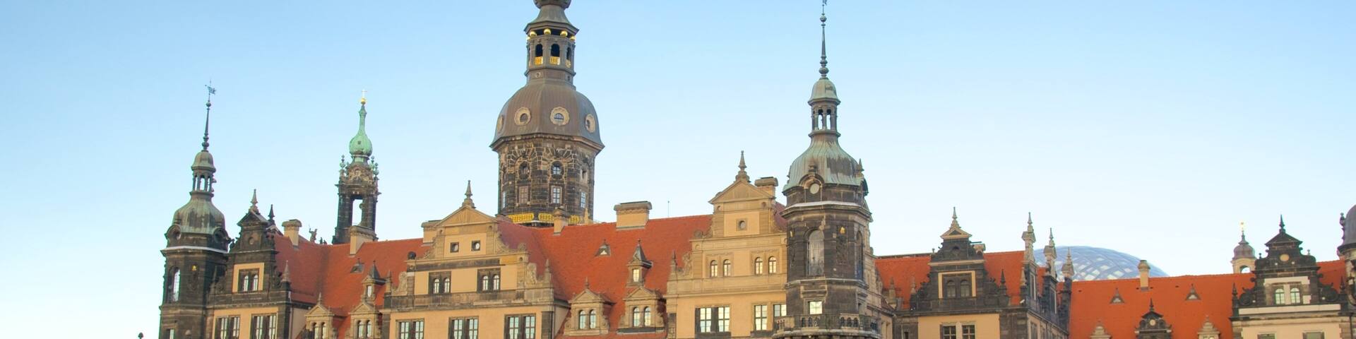 A historic building with ornate architecture, including multiple spires and a prominent clock tower.