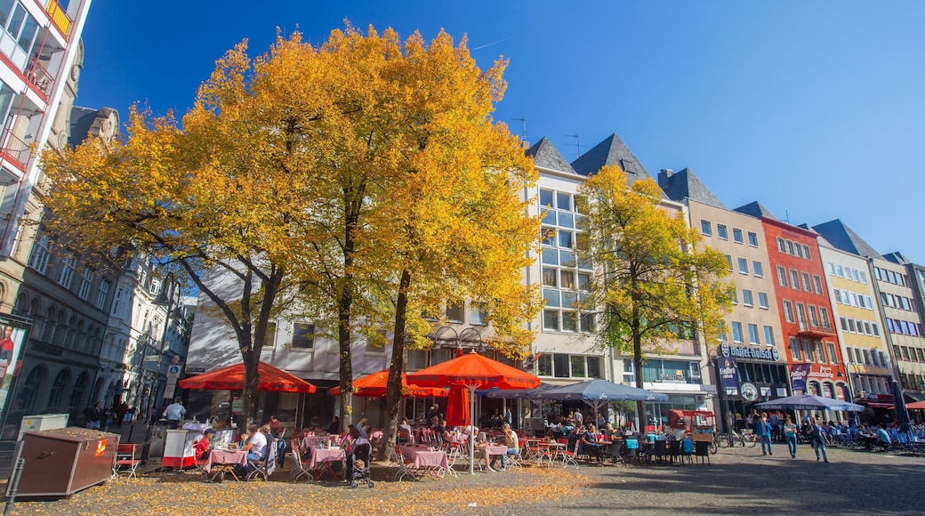 Alter Markt showing outdoor eating and a city as well as a small group of people