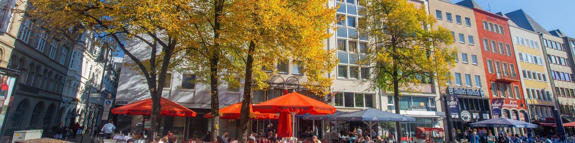 Alter Markt showing outdoor eating and a city as well as a small group of people