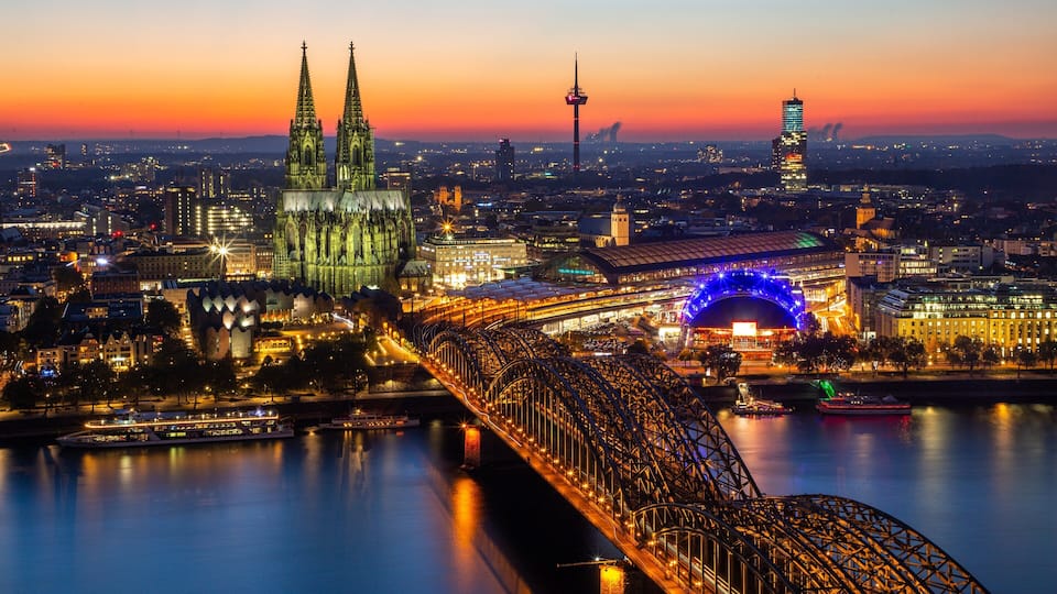 Hohenzollern Bridge showing a river or creek, heritage architecture and a city