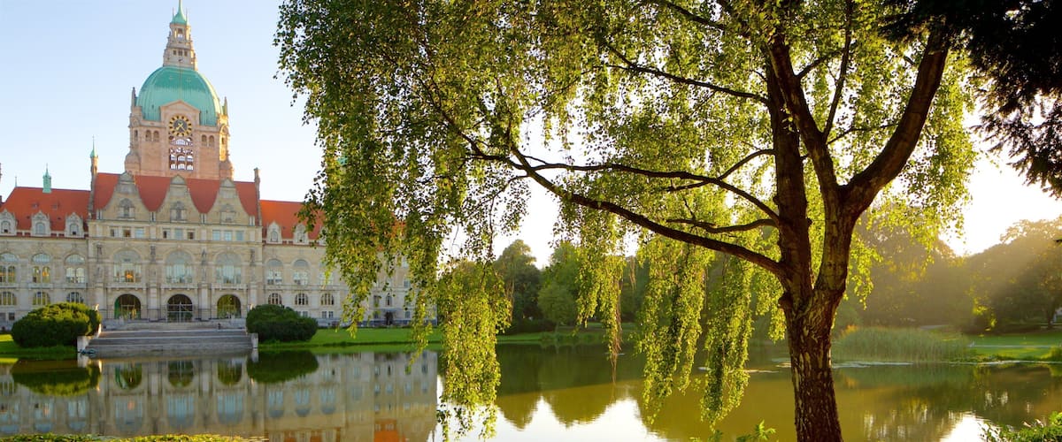 New Town Hall featuring heritage architecture, a lake or waterhole and a sunset