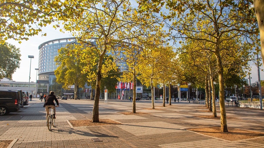 Congress Center Messe Frankfurt which includes road cycling, a sunset and a square or plaza