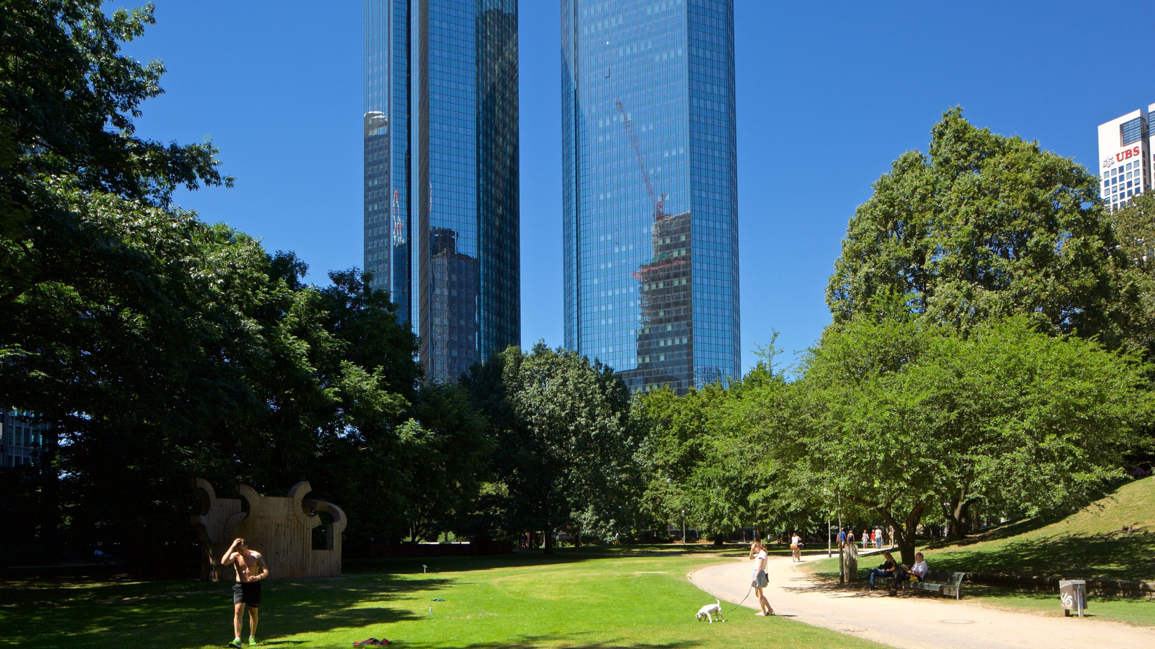 Deutsche Bank Twin Towers showing a garden and a high rise building