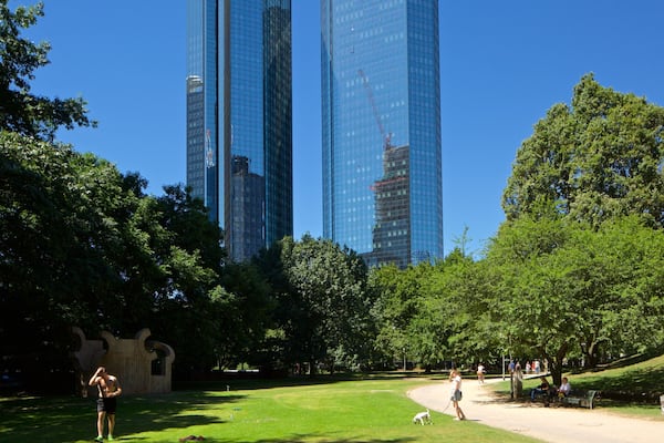 Deutsche Bank Twin Towers showing a garden and a high rise building