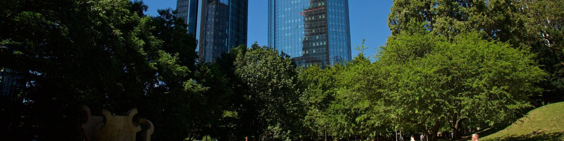 Deutsche Bank Twin Towers which includes a park and a high rise building