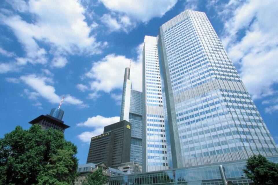 A modern cityscape with tall skyscrapers, a traditional pagoda, and lush green trees.