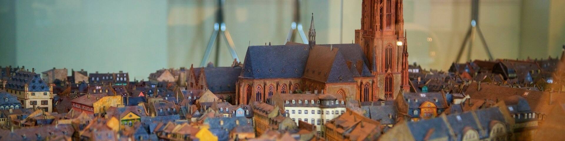 A detailed model of a historic European city with a prominent cathedral and various colorful buildings.