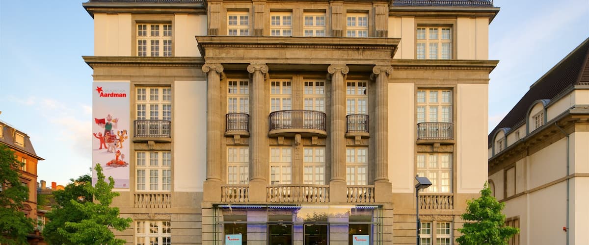 German Film Museum which includes signage, a sunset and heritage architecture