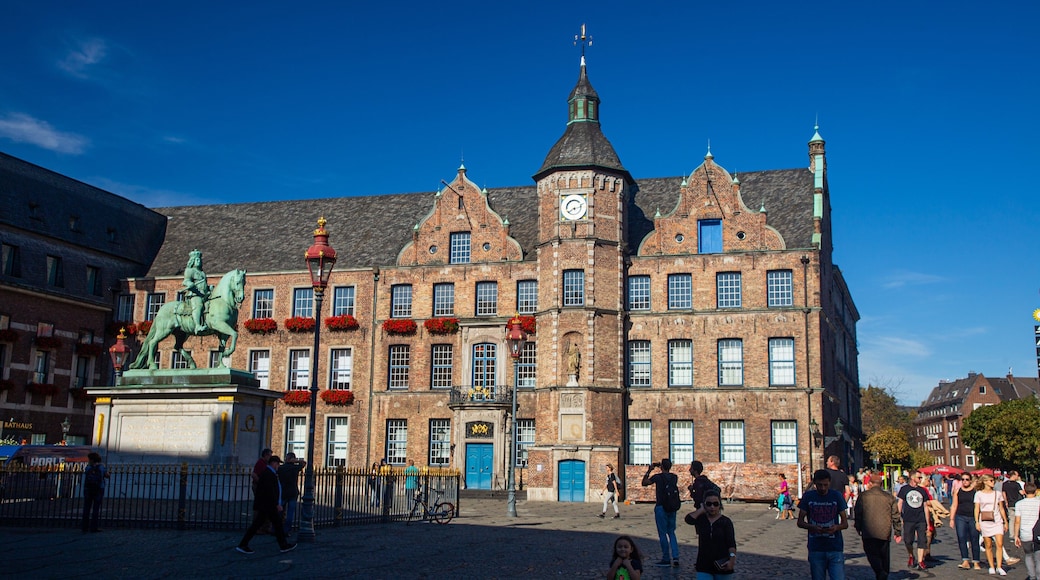Marktplatz featuring a statue or sculpture, street scenes and heritage architecture