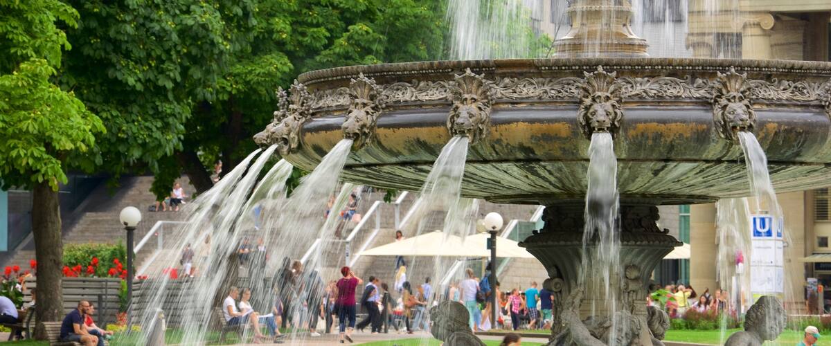 Schlossplatz featuring a fountain and street scenes