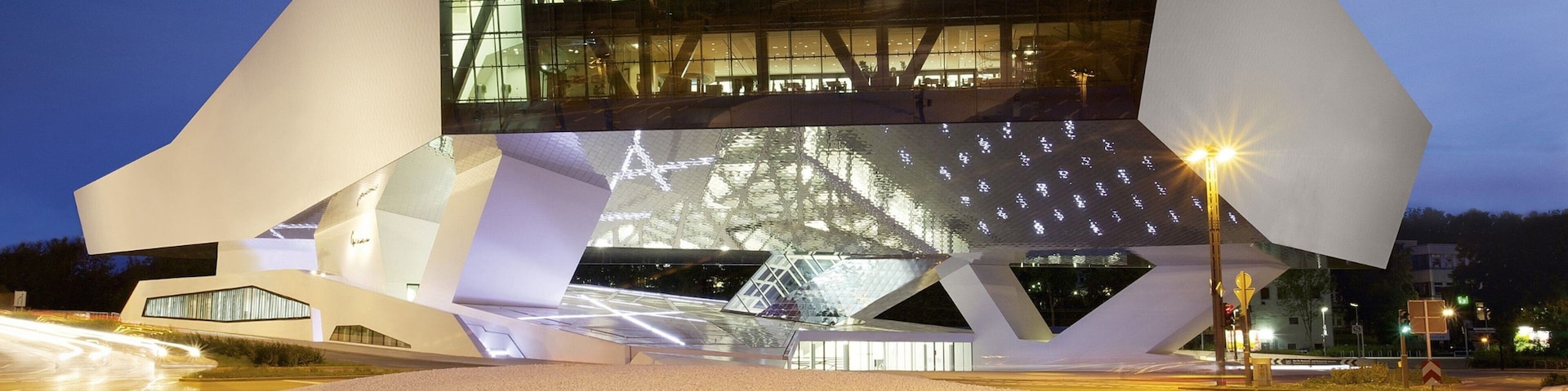 Porsche Museum showing night scenes and modern architecture