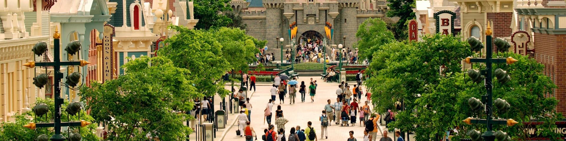 Hong Kong Disneyland® Resort featuring rides as well as a large group of people