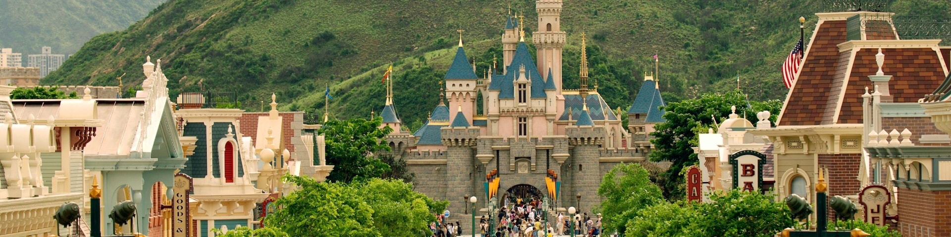 Hong Kong Disneyland® Resort featuring rides as well as a large group of people