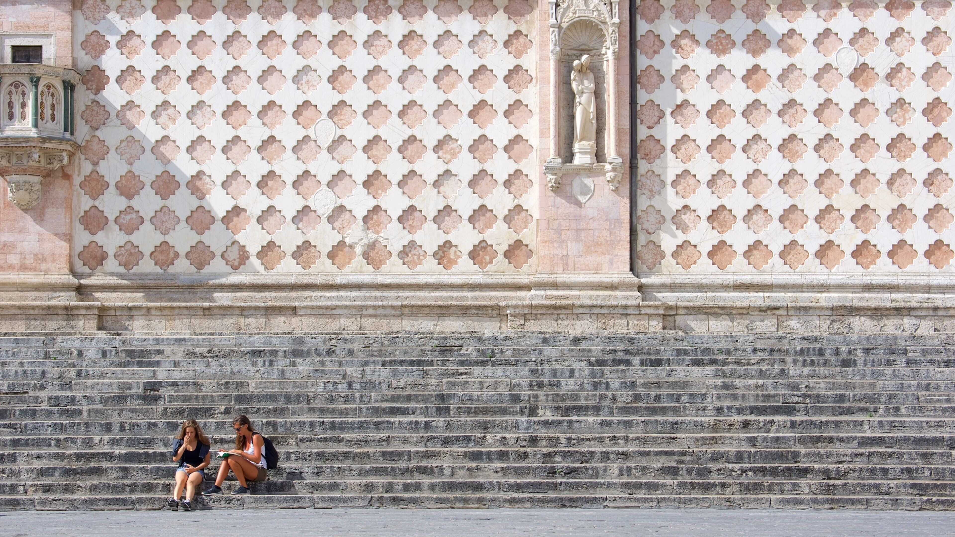 Piazza IV Novembre as well as a couple