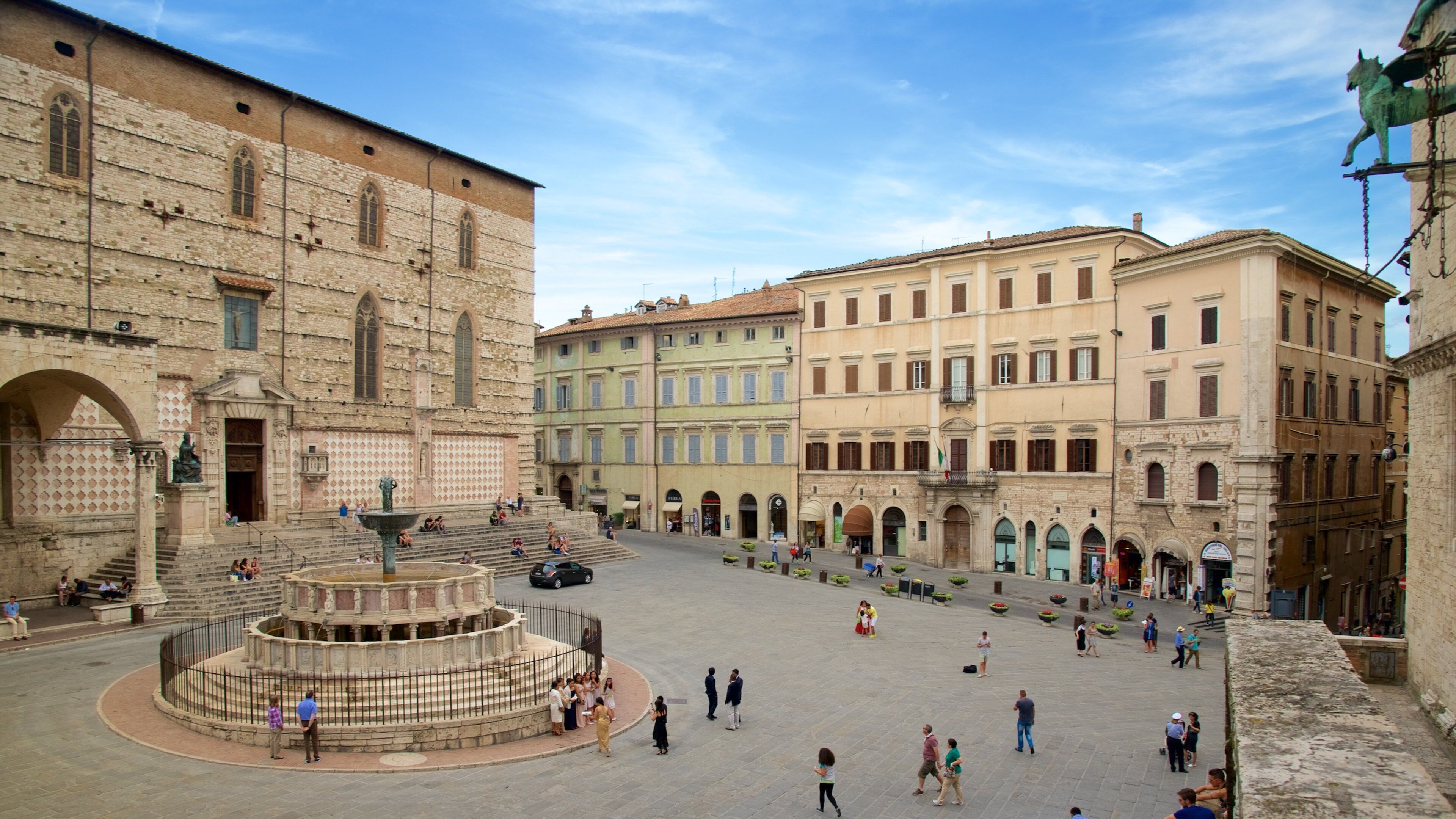 Piazza IV Novembre which includes heritage architecture, a city and a square or plaza
