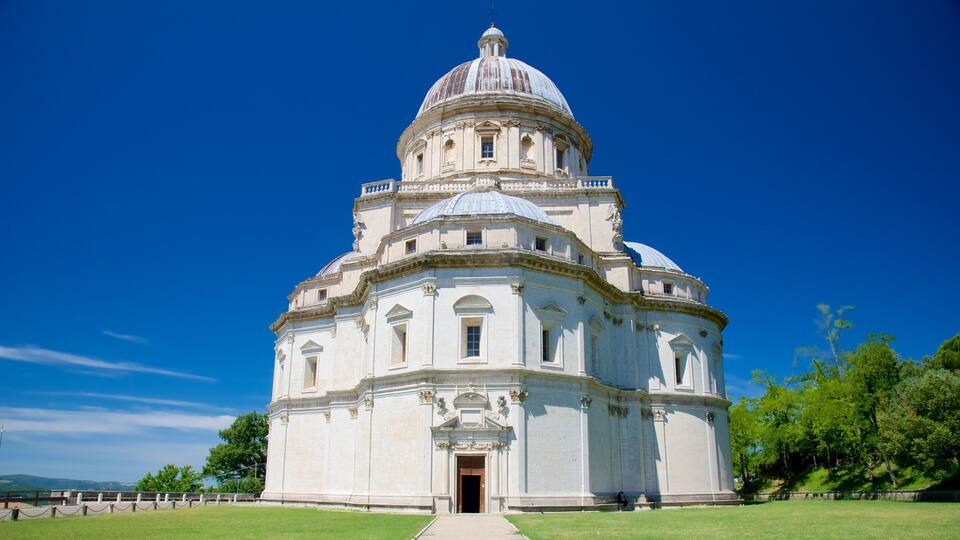 A large white domed building with a central entrance and a smaller dome on top.