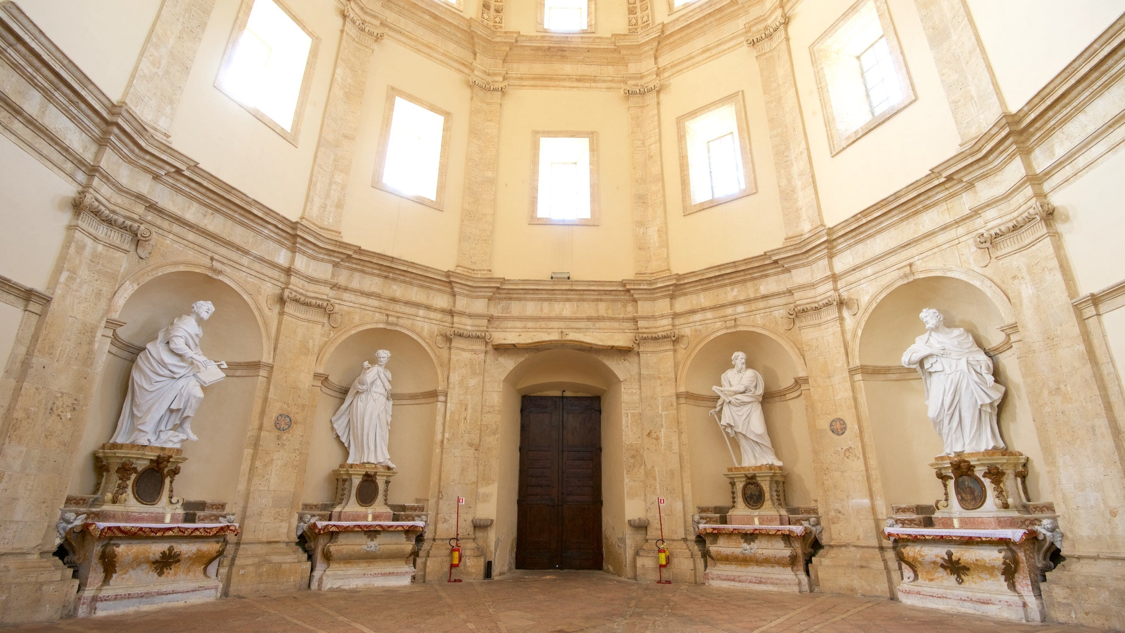 Santa Maria della Consolazione featuring a statue or sculpture, a church or cathedral and interior views