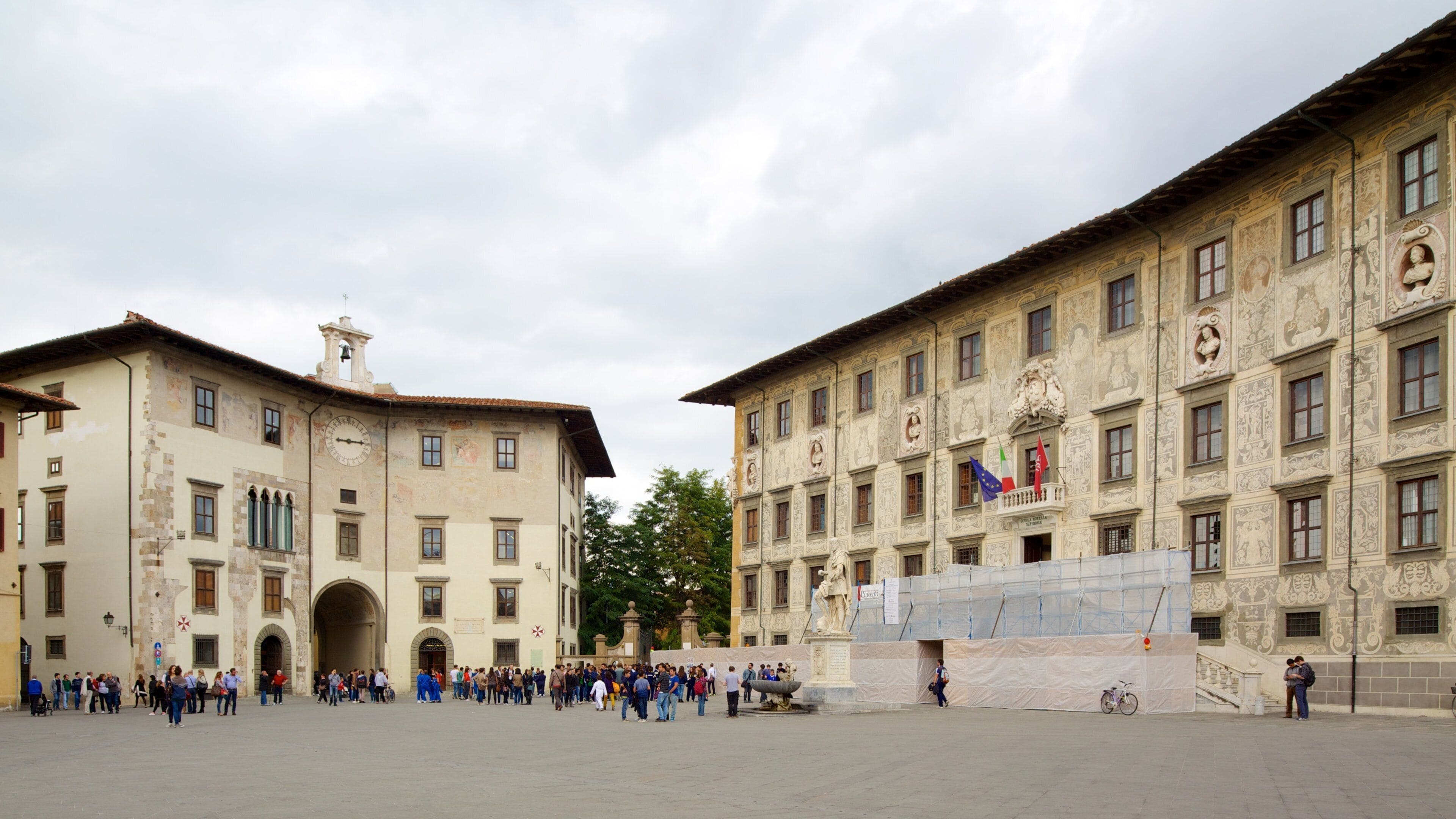 Palazzo della Carovana which includes a square or plaza, heritage architecture and a city