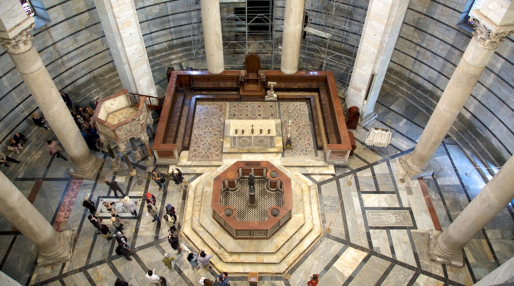 Pisa Baptistry which includes interior views, heritage elements and a church or cathedral