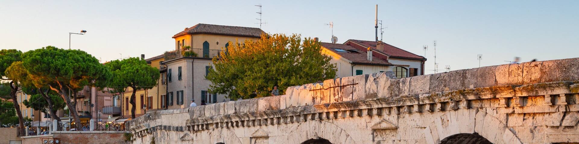 Tiberius Bridge which includes a sunset, a river or creek and a bridge