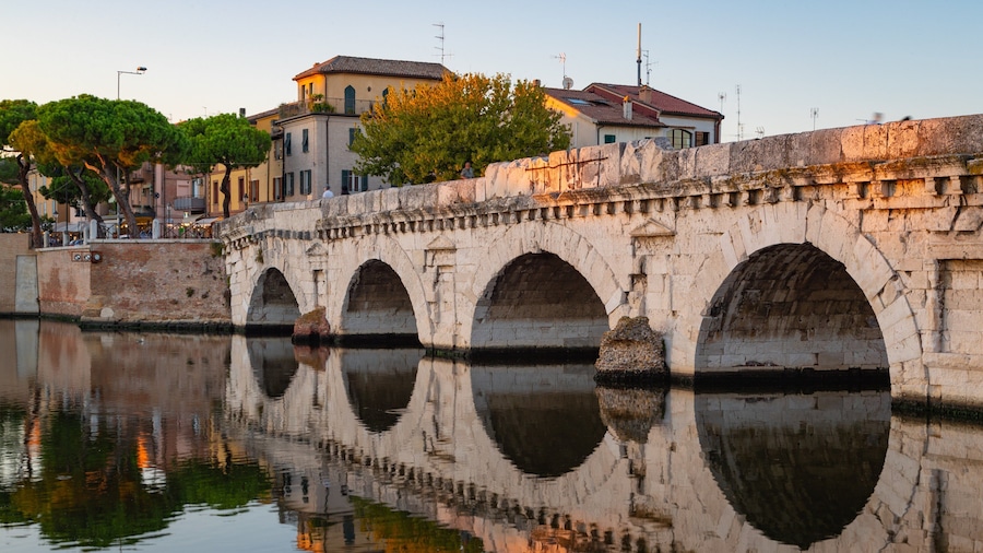 Tiberius Bridge which includes a sunset, a river or creek and a bridge