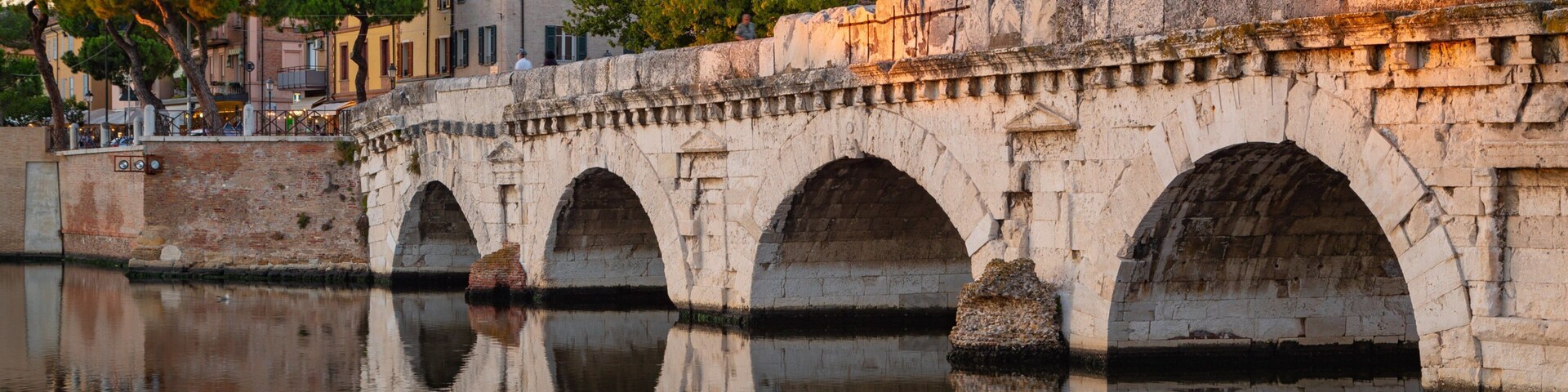 Tiberius Bridge which includes a sunset, a river or creek and a bridge