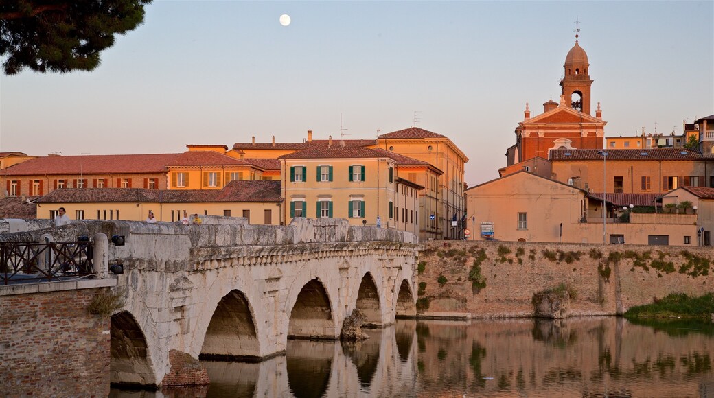 Tiberius Bridge which includes a bridge, a river or creek and a sunset