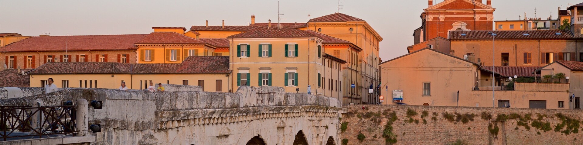 Tiberius Bridge showing a bridge, a sunset and a river or creek