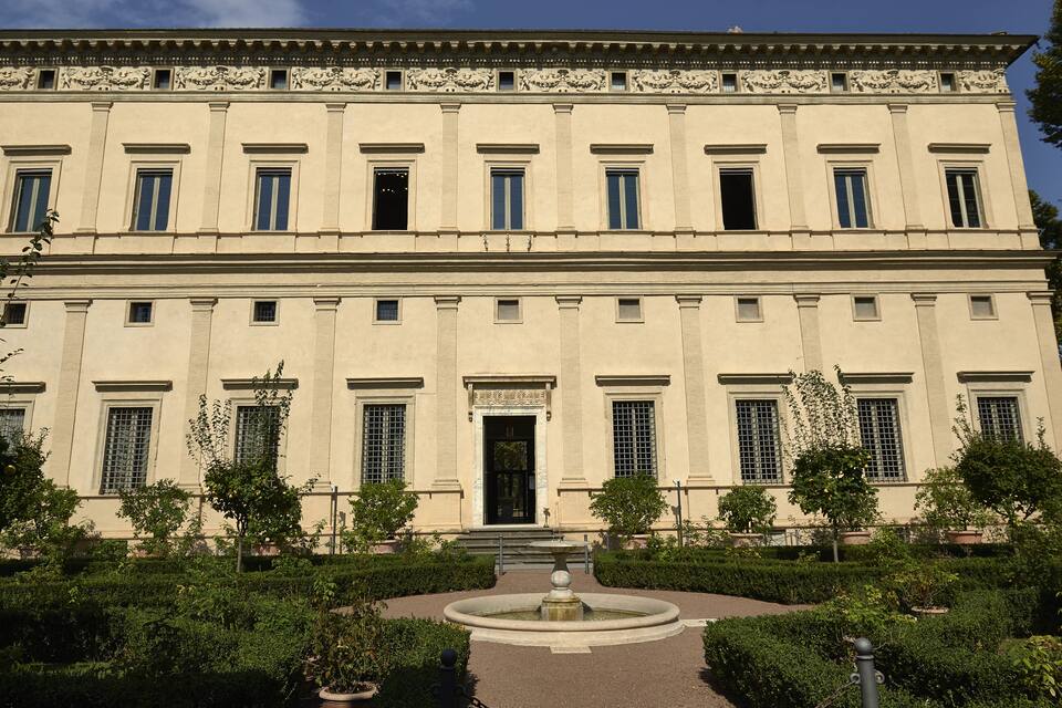 A large classical building with symmetrical windows and a central entrance.