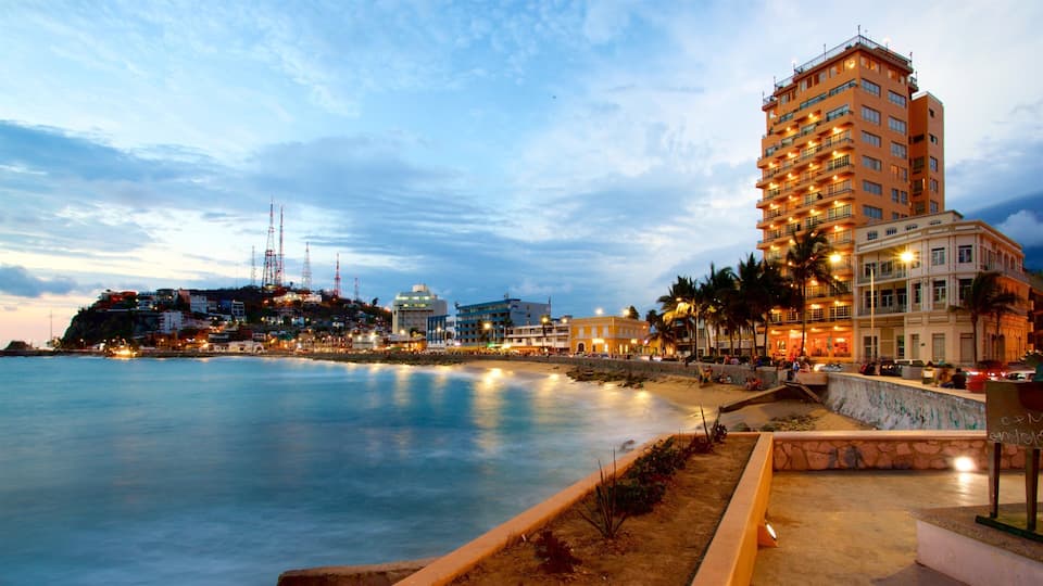 Olas Altas Beach showing a sunset and general coastal views