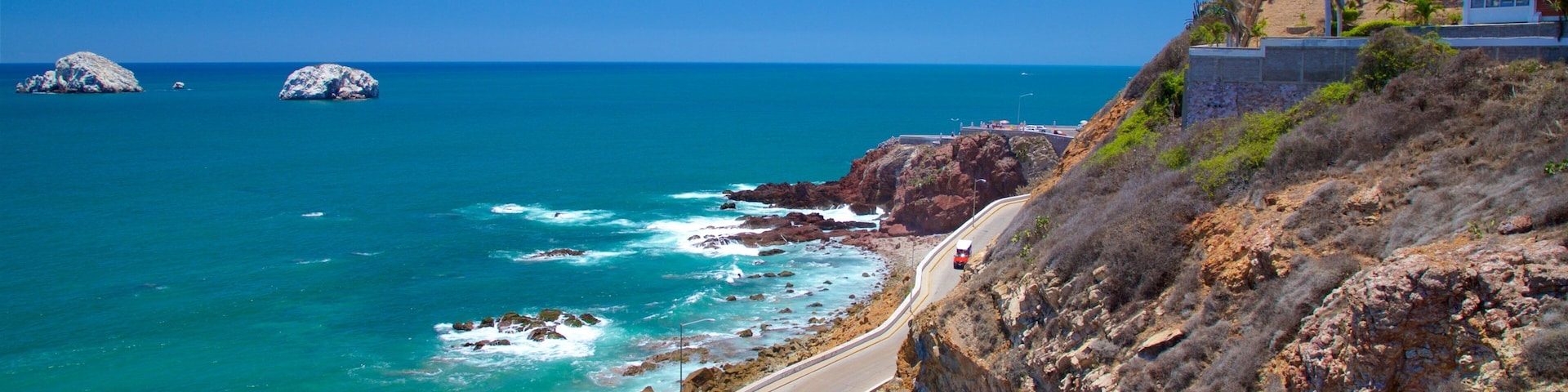 El Mirador ofreciendo litoral rocoso y vistas de una costa