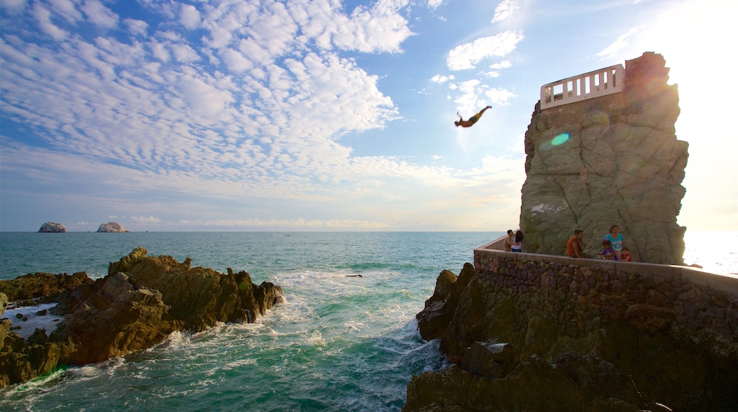 Divers Point which includes rugged coastline, a square or plaza and views
