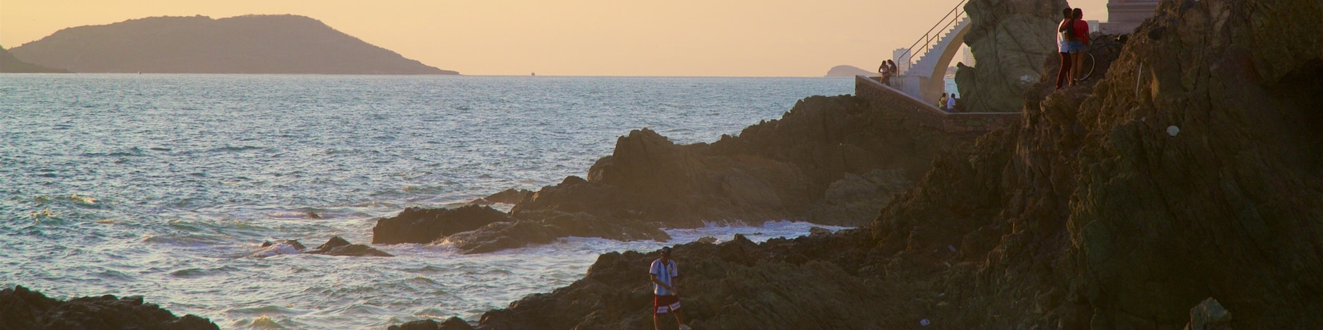 Divers Point which includes rugged coastline, views and a sunset