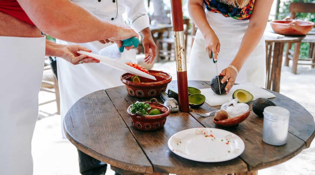 Las Caletas Beach showing food as well as a small group of people