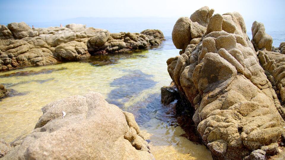 Rocky formations near a clear water body.