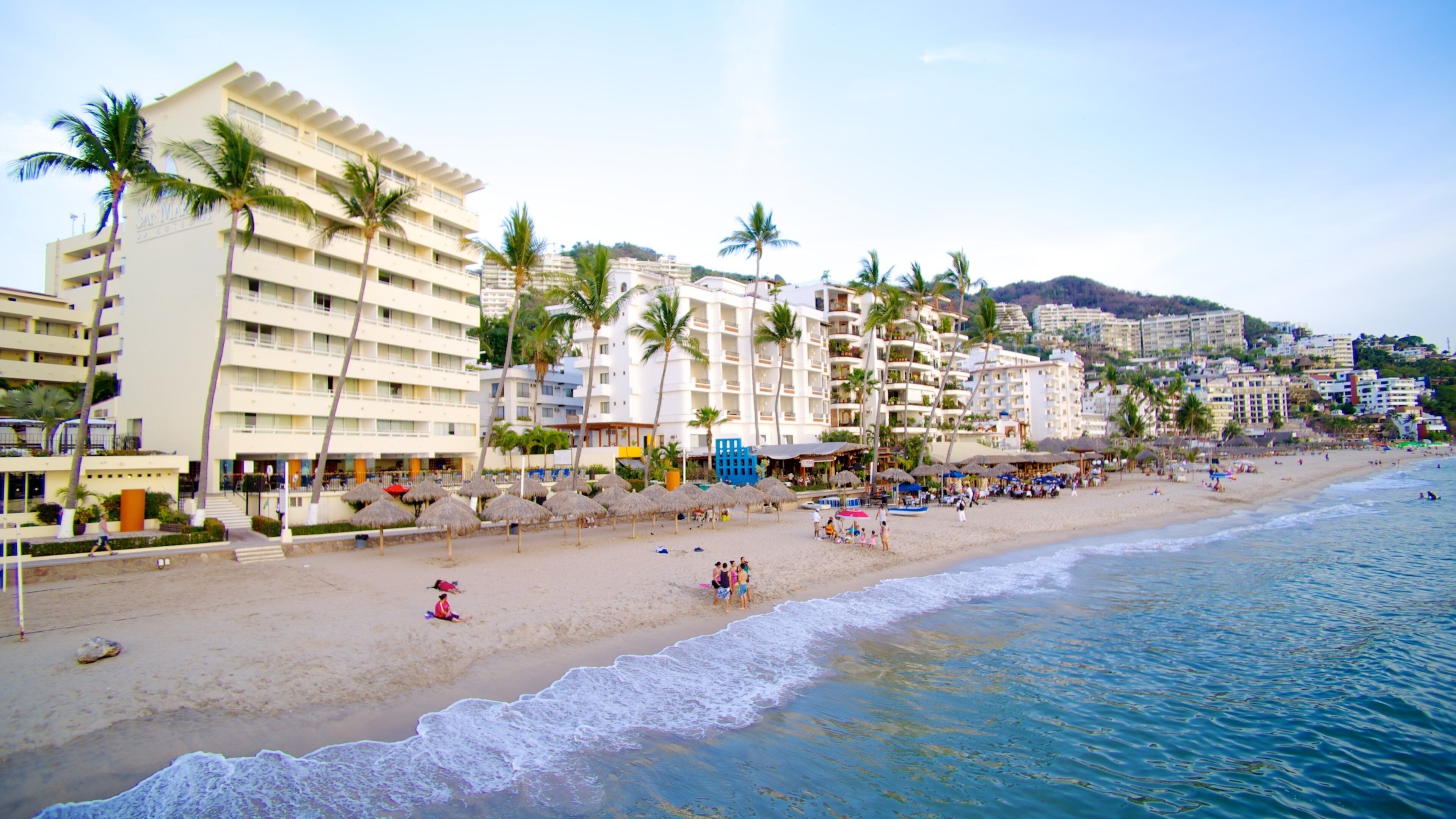Bay of Banderas showing tropical scenes, a beach and a coastal town