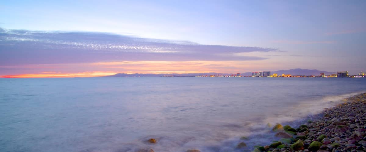Bay of Banderas showing landscape views, a coastal town and a pebble beach