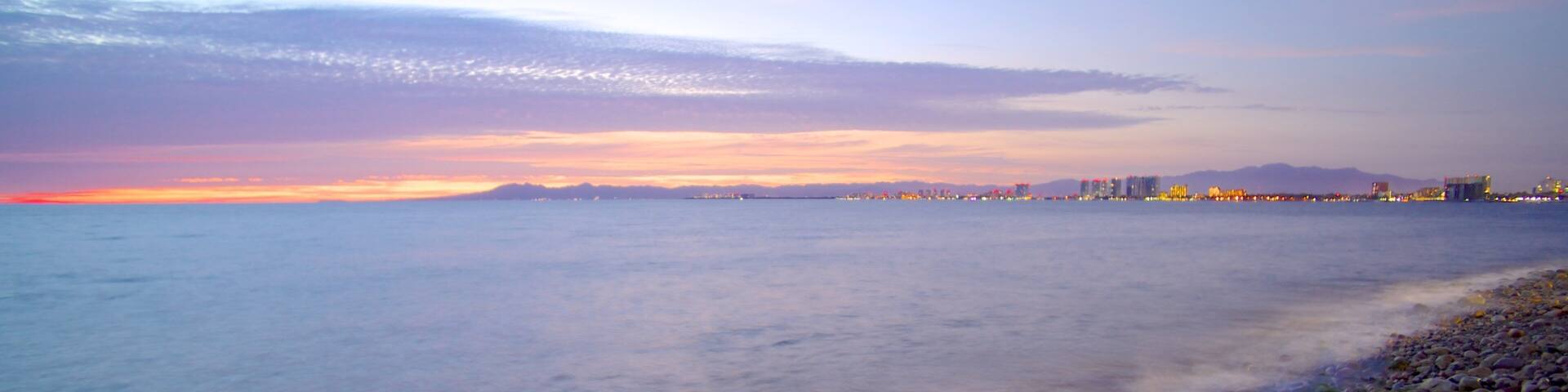 Bay of Banderas showing landscape views, a pebble beach and a coastal town