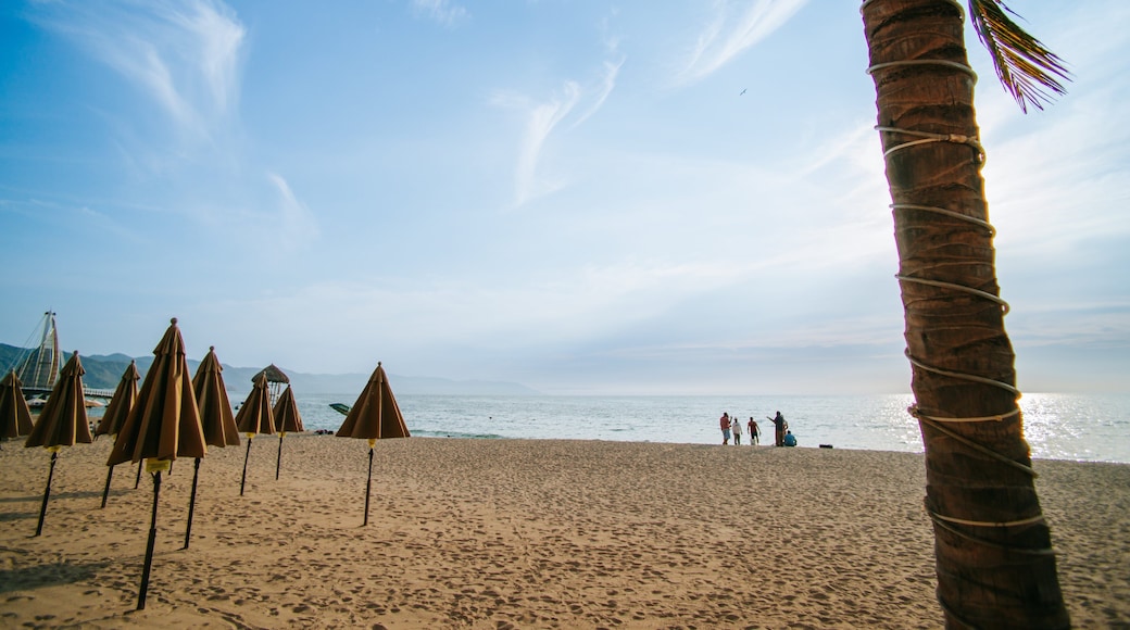 Bay of Banderas featuring a sunset, a sandy beach and general coastal views