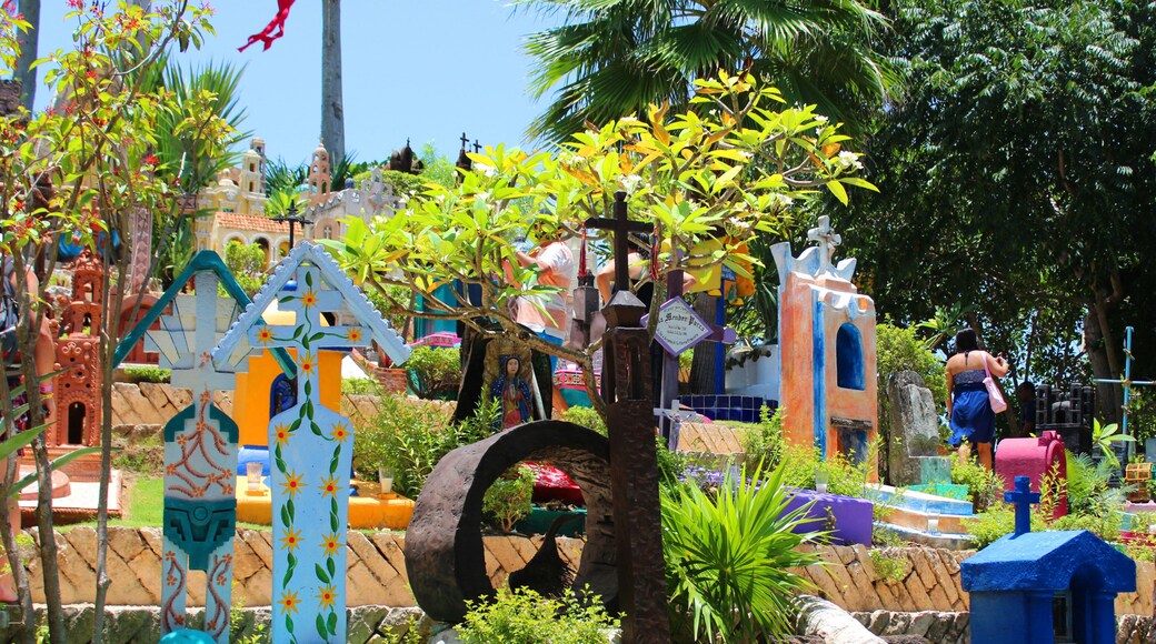 Mexican bright cemetery in Xcaret, famous ecotourism and archaeological park on the mexican Riviera Maya, Quintana Roo, Yucatan, Mexico. Soft focus. Xcaret translates from Maya, means "small bay"