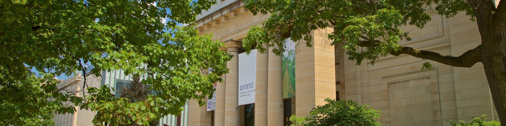 University of Michigan Museum of Art showing a garden and heritage architecture as well as a small group of people