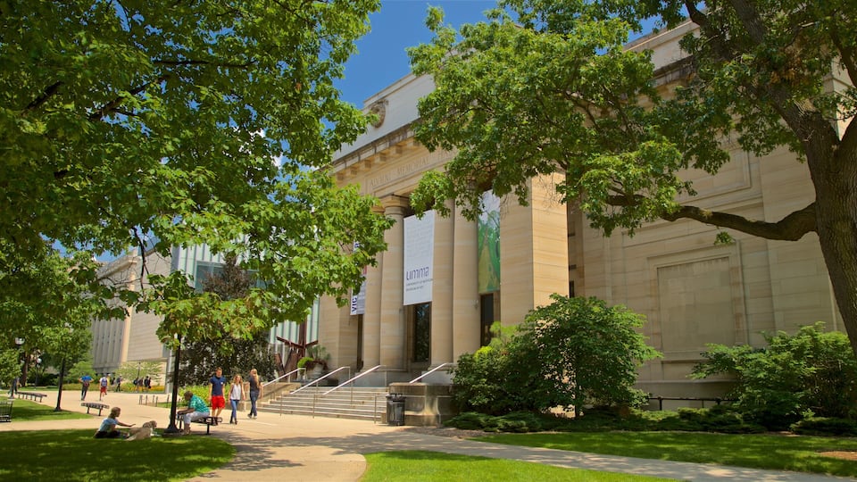 University of Michigan Museum of Art which includes heritage architecture and a garden as well as a small group of people