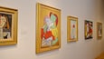 Een galerij met diverse ingekaderde kunstwerken.