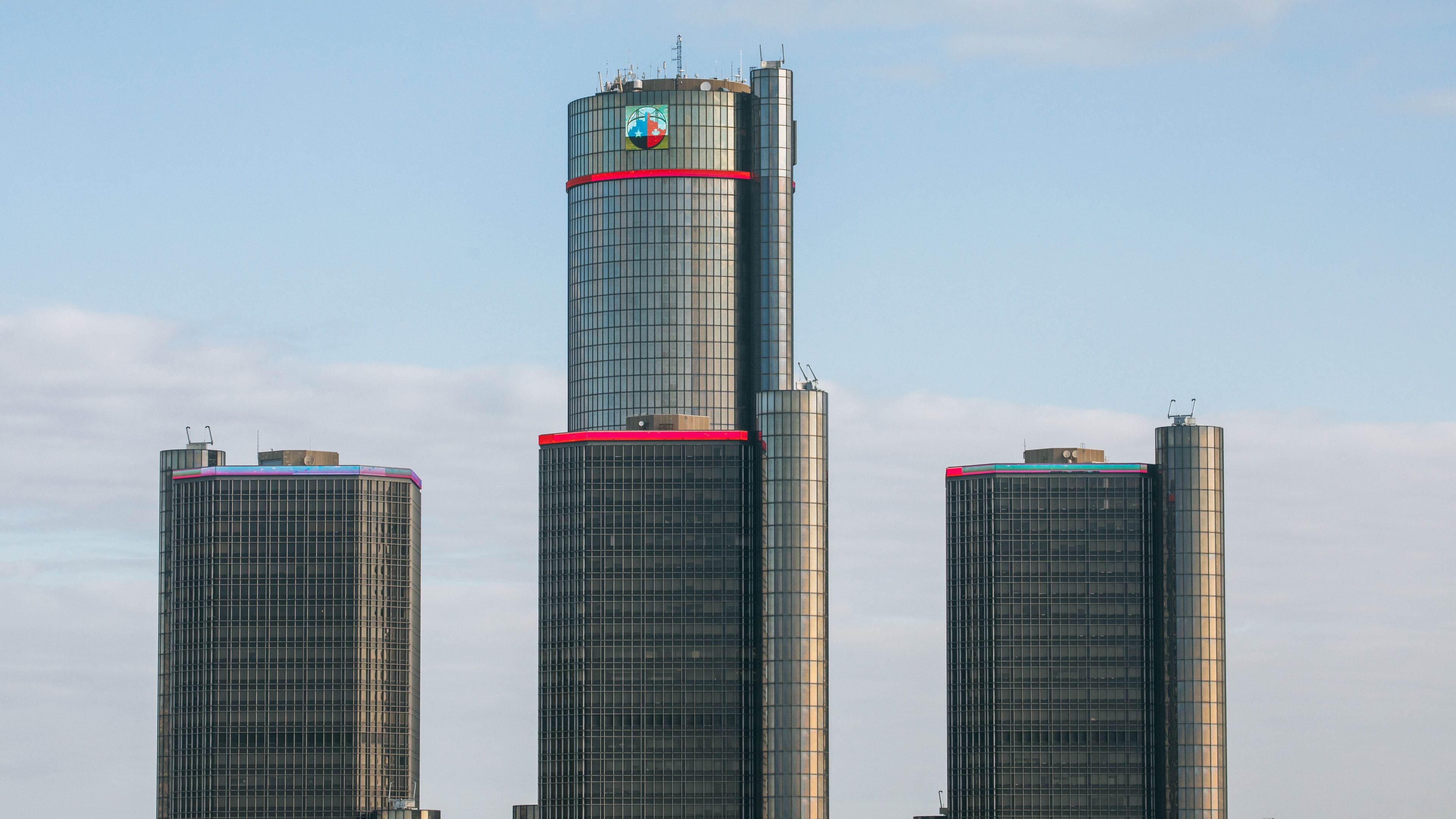 GM Renaissance Center featuring a high rise building and signage